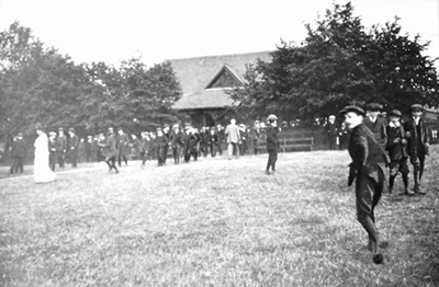 historic picture of the cadbury barn with visitors